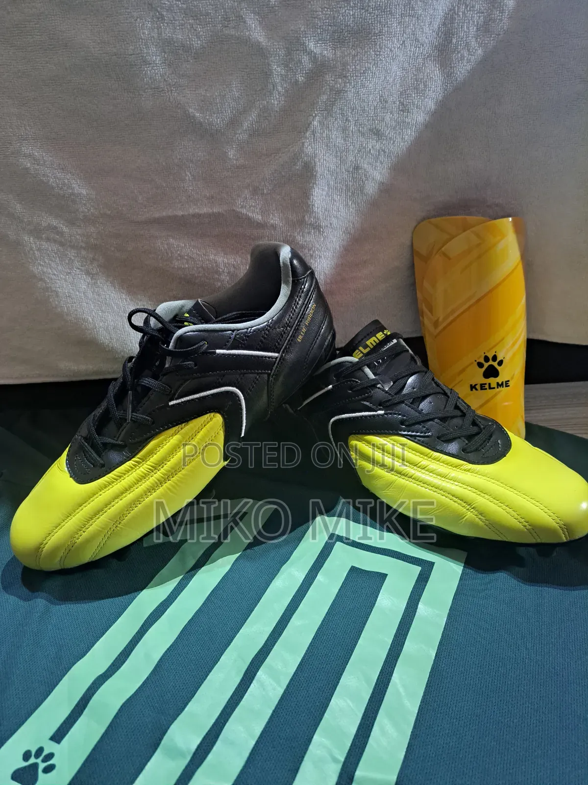 KELME Football Cleats + Shin Guards