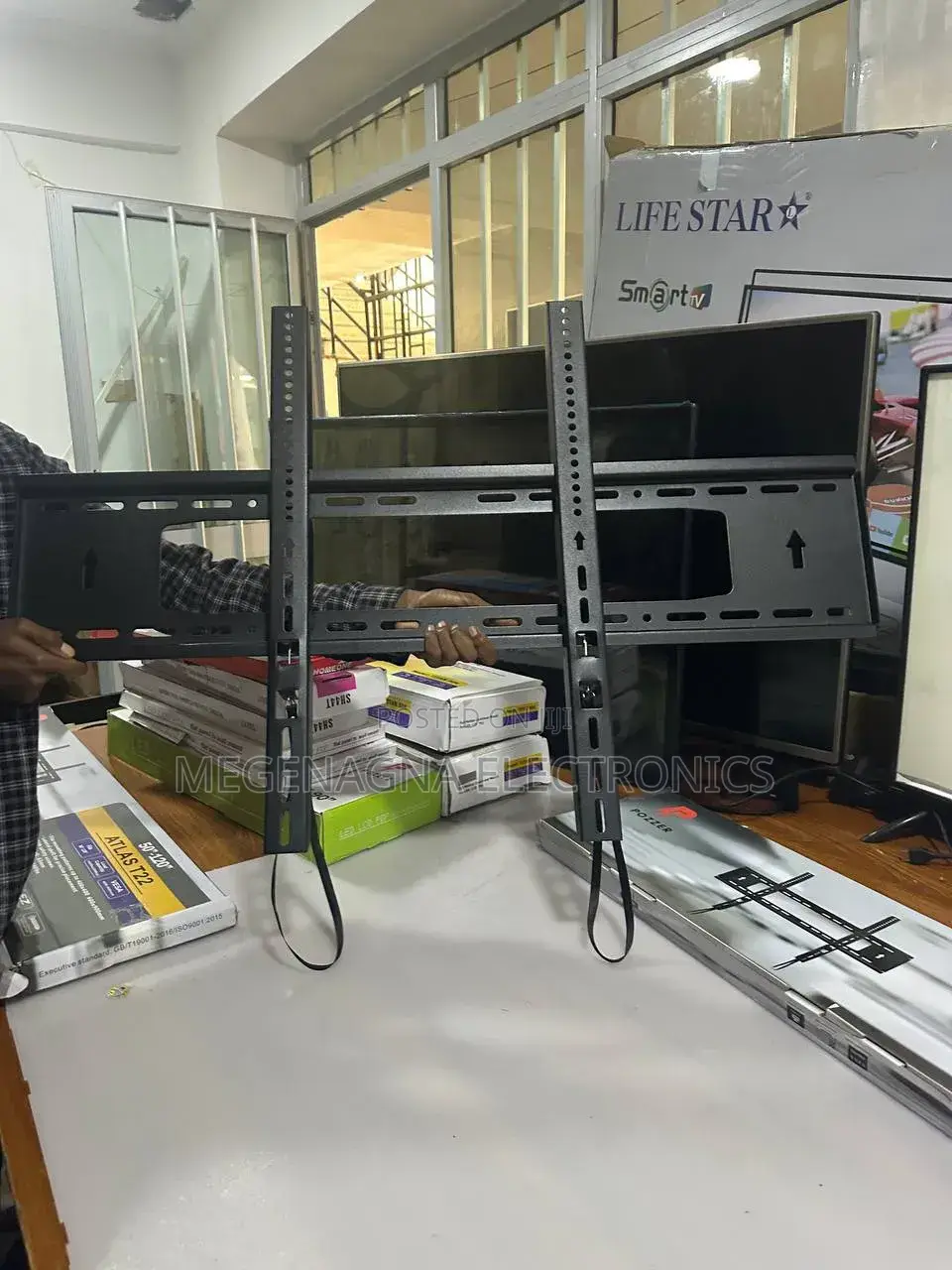 TV Wall Mount ተቪ መስቀያ