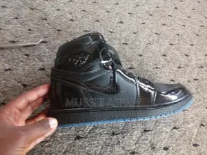 Air Jordan 1 High Triple Black Patent Leather Sneakers