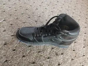 Air Jordan 1 High Triple Black Patent Leather Sneakers
