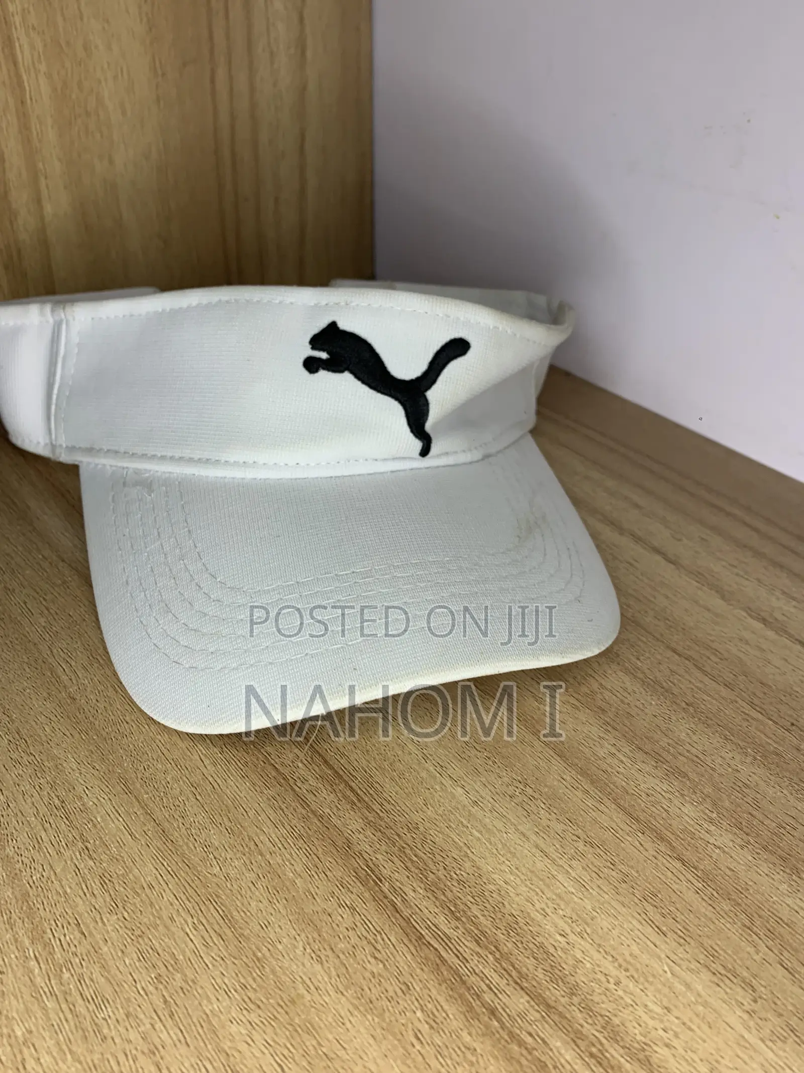 Black Jumping Cat Logo on the Front.