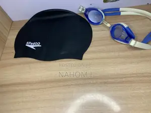 A Black Speedo Swim Cap Alongside Blue-and-White Speedo Jet Swimming