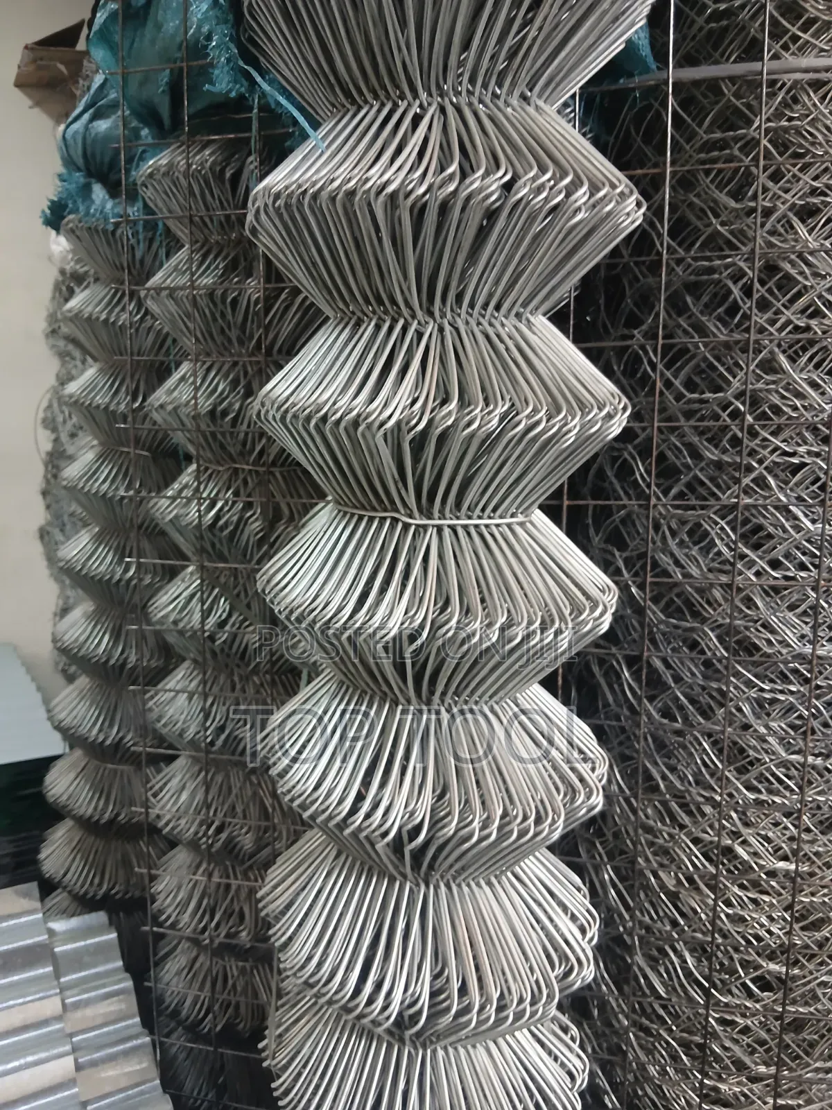 ,Appears to Be a Roll of Galvanized Steel Chain-Link Fencing.