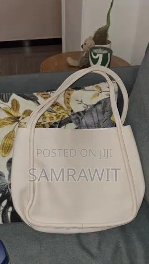 An Off-White Minimalist Shoulder Tote Bag.