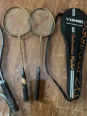 Two Gold-Colored Recreational Badminton