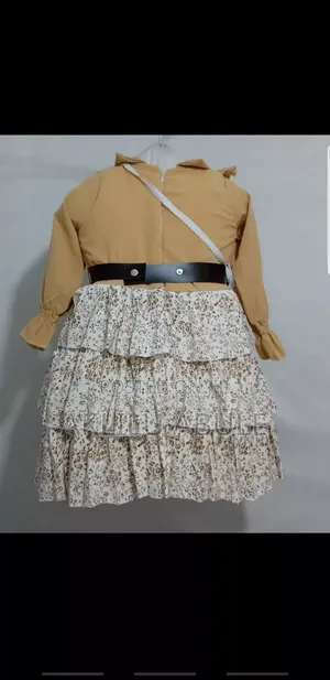 የልጆች ቀሚስ በሚያምር ዲዛይን