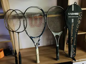 Stringed Sport Racquets—two Smaller Golden