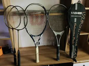 Stringed Sport Racquets—two Smaller Golden