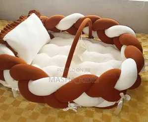 Baby Nest Featuring a Soft Brown-and-White Woven