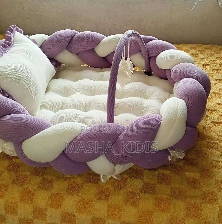 Baby Nest Featuring a Soft Brown-and-White Woven