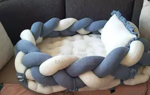 Baby Nest Featuring a Soft Brown-and-White Woven