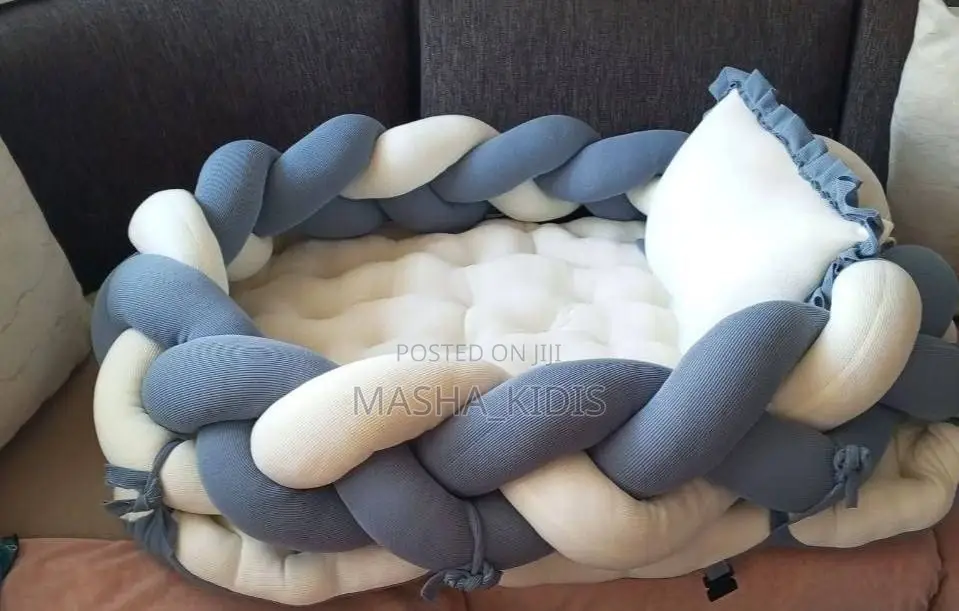 Baby Nest Featuring a Soft Brown-and-White Woven