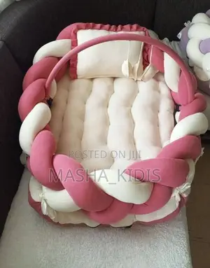 Baby Nest Featuring a Soft Brown-and-White Woven