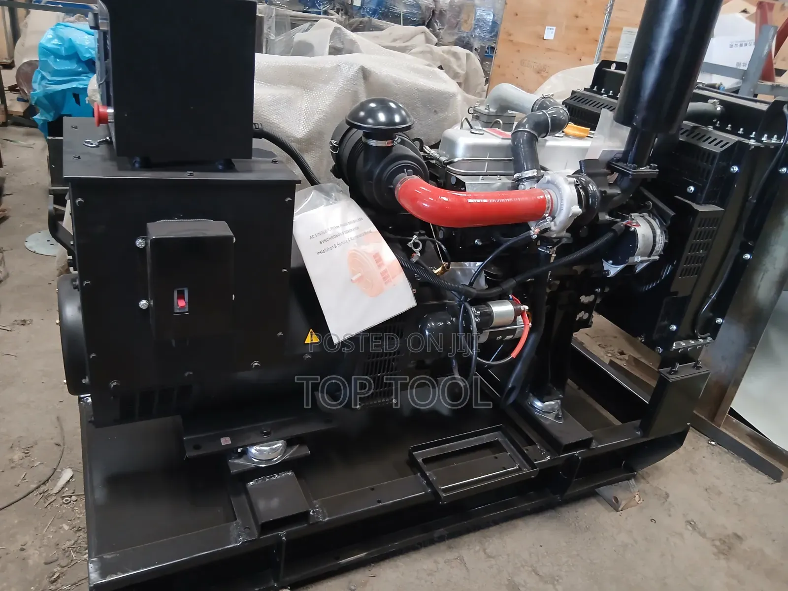 ,Industrial Diesel Generator Set Mounted on a Black Steel Skid Frame.