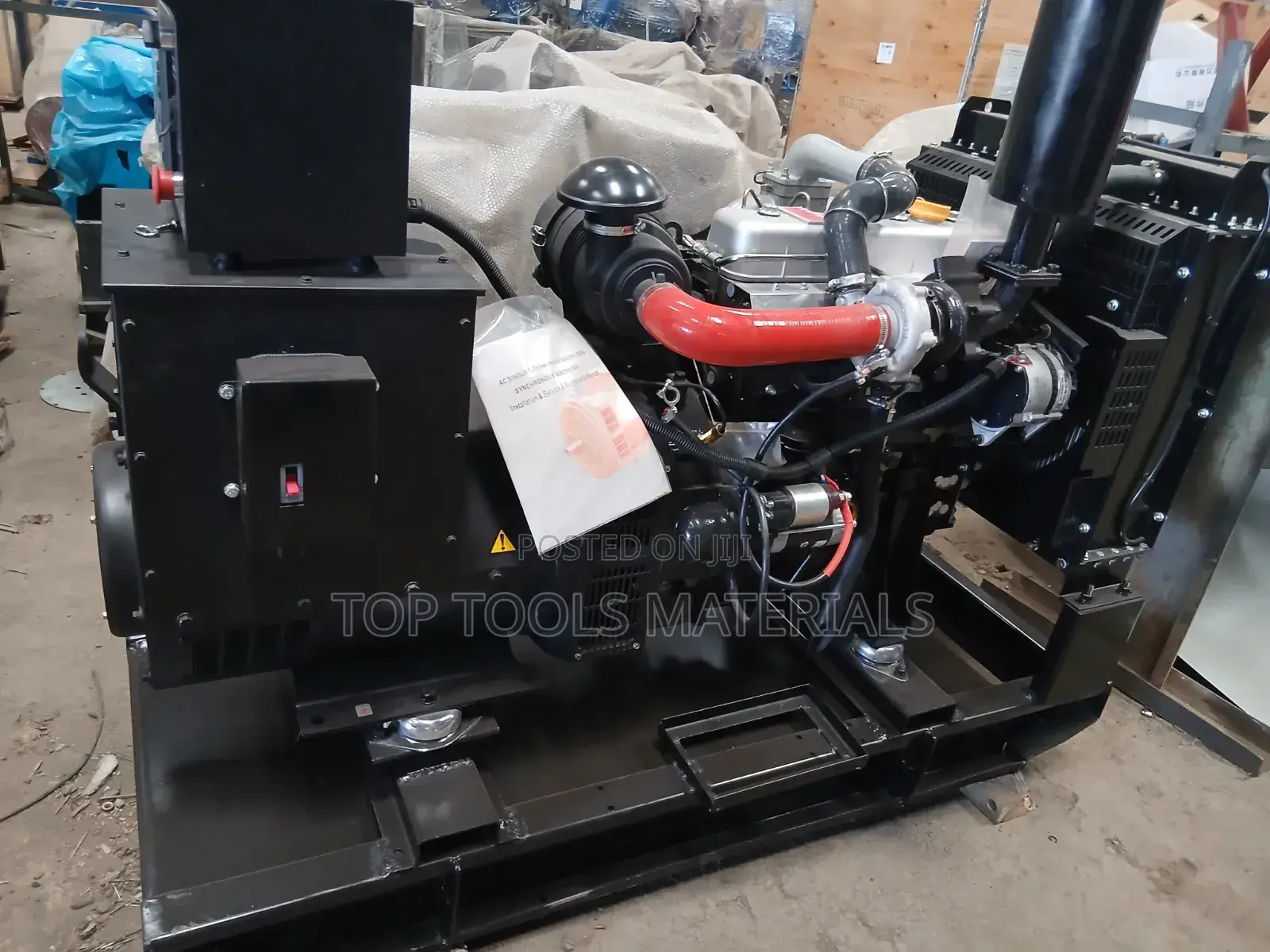 ,Industrial Diesel Generator Set Mounted on a Black Steel Skid Frame.