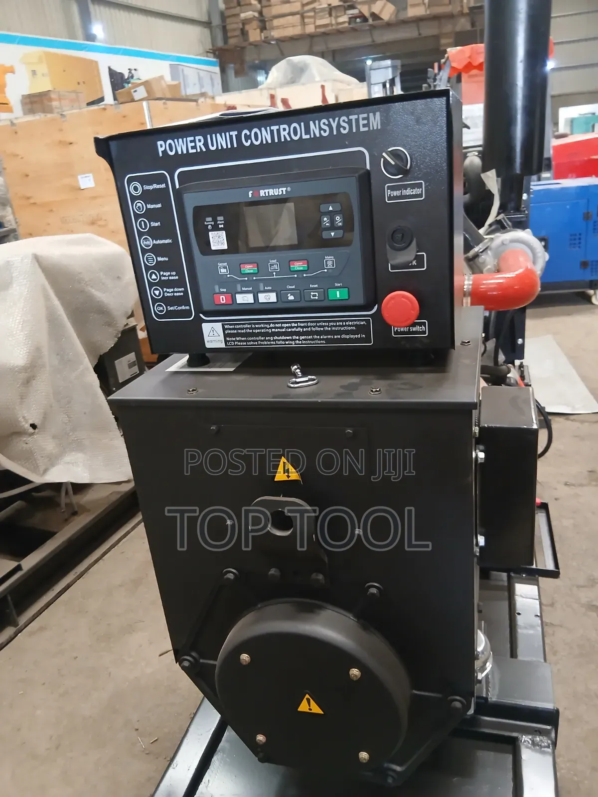 ,Industrial Diesel Generator Set Mounted on a Black Steel Skid Frame.