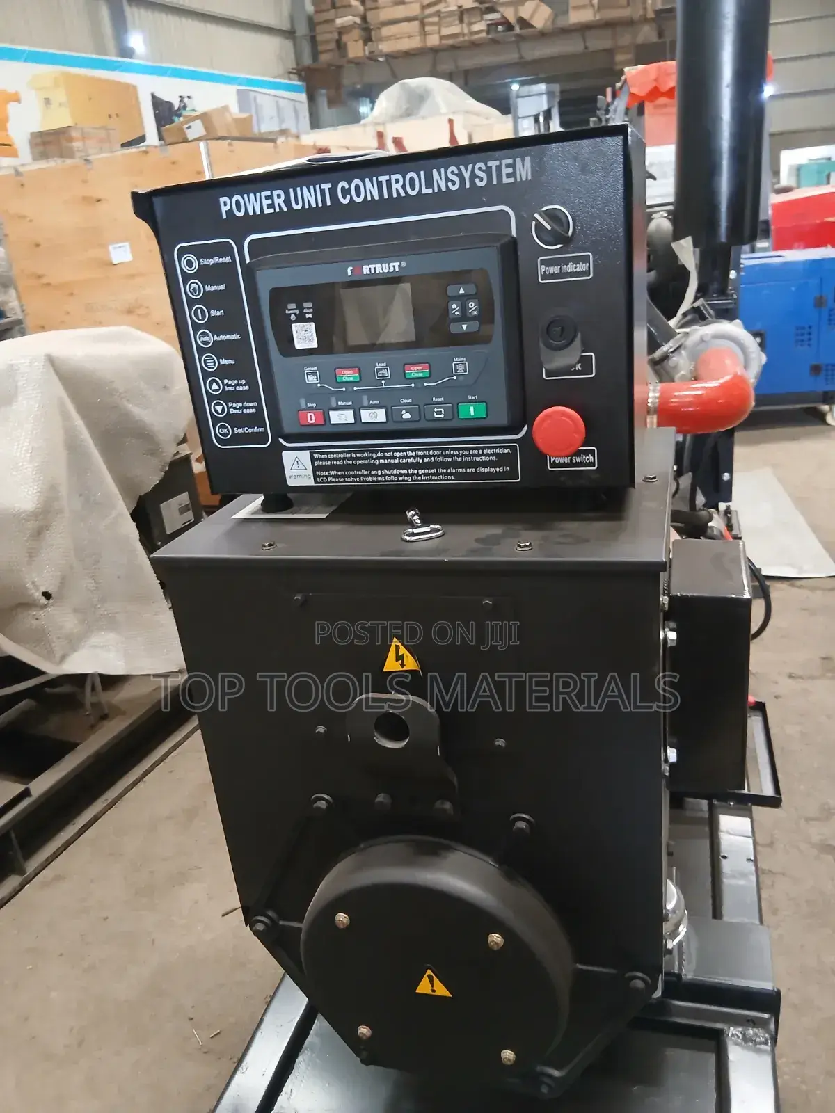 ,Industrial Diesel Generator Set Mounted on a Black Steel Skid Frame.
