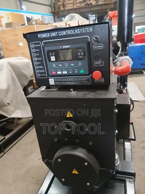 ,Industrial Diesel Generator Set Mounted on a Black Steel Skid Frame.