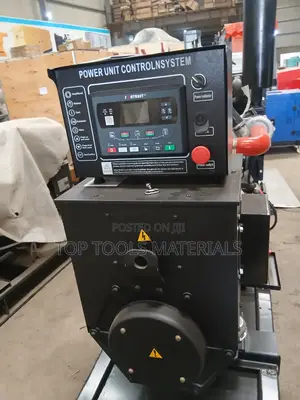 ,Industrial Diesel Generator Set Mounted on a Black Steel Skid Frame.