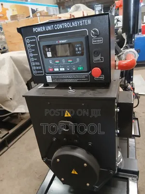 ,Industrial Diesel Generator Set Mounted on a Black Steel Skid Frame.