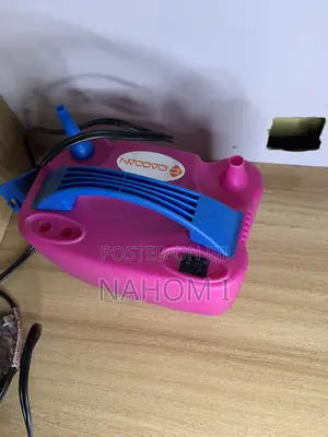 This Is an IDAODAN Portable Dual-Nozzle Electric Balloon Pump in Pink