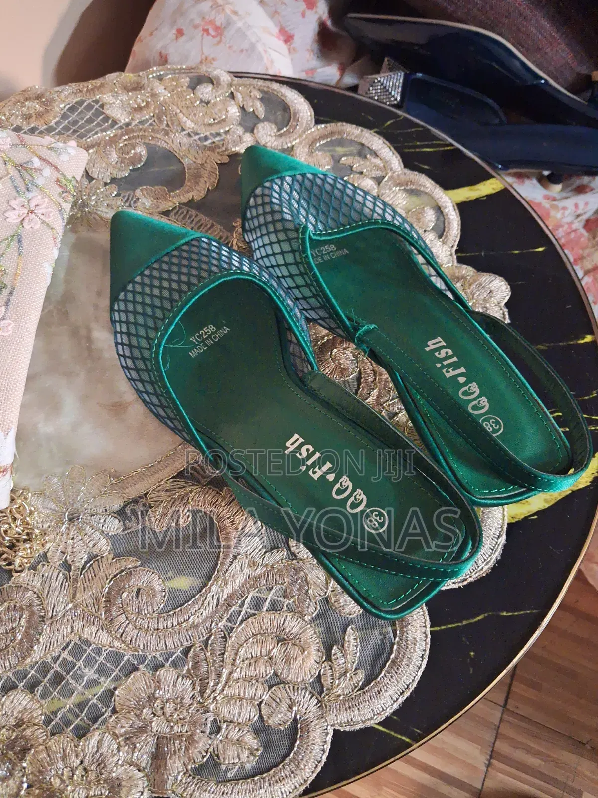 A Mesh Vamp Design and a "QQ-Fish" Brand Label With Size 38