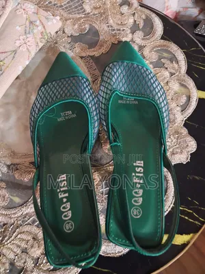 A Mesh Vamp Design and a "QQ-Fish" Brand Label With Size 38