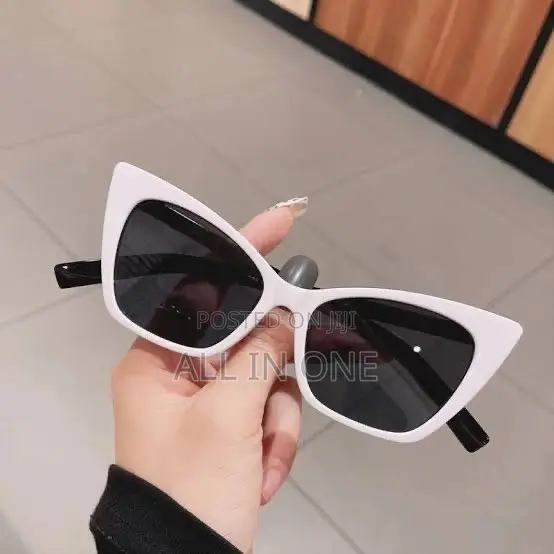 White Cat-Eye Sunglasses Featuring Dark Tinted Lenses