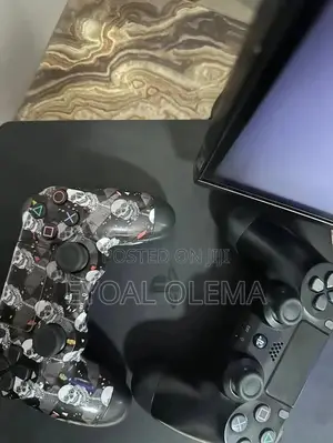 PS4 Slim + 2 Joysticks + Games (Ghost of Tsushima, RDR2, GTA 5)