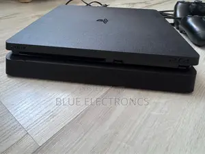 PlayStation 4 Slim + Two Original Controllers