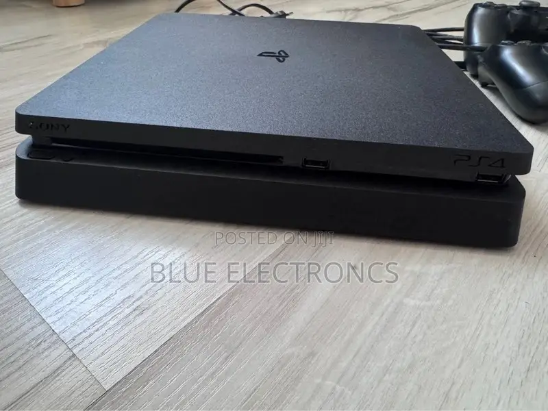 PlayStation 4 Slim + Two Original Controllers