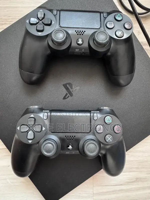 PlayStation 4 Slim + Two Original Controllers