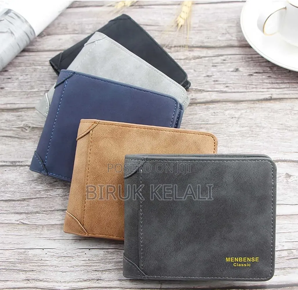 Wallet in a Dark Grey Finish With Visible Vertical Stitching Detail.