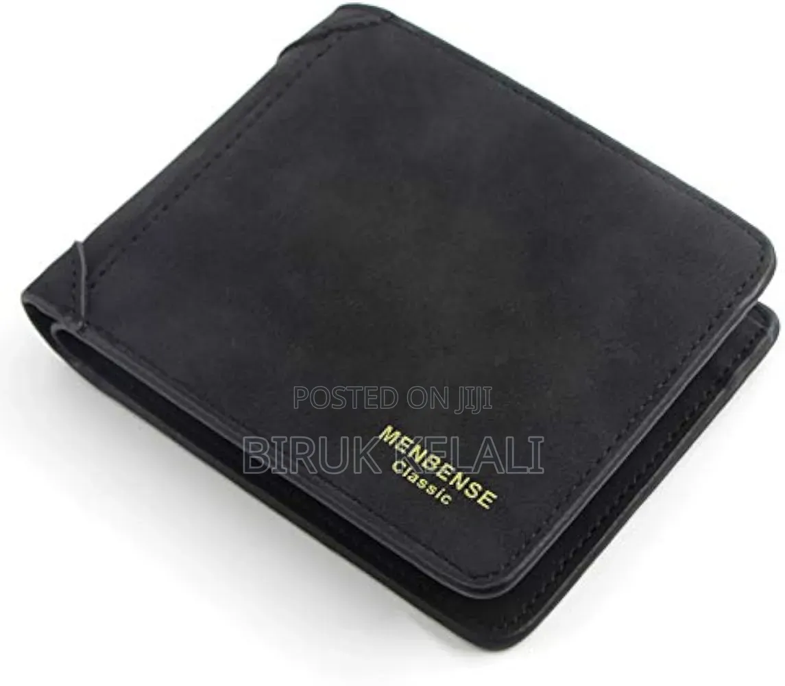 Wallet in a Dark Grey Finish With Visible Vertical Stitching Detail.