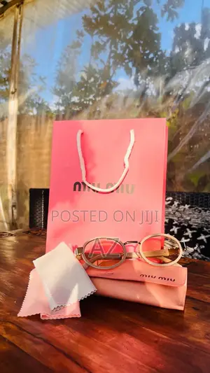 Miu Miu Oval Metal Sunglasses