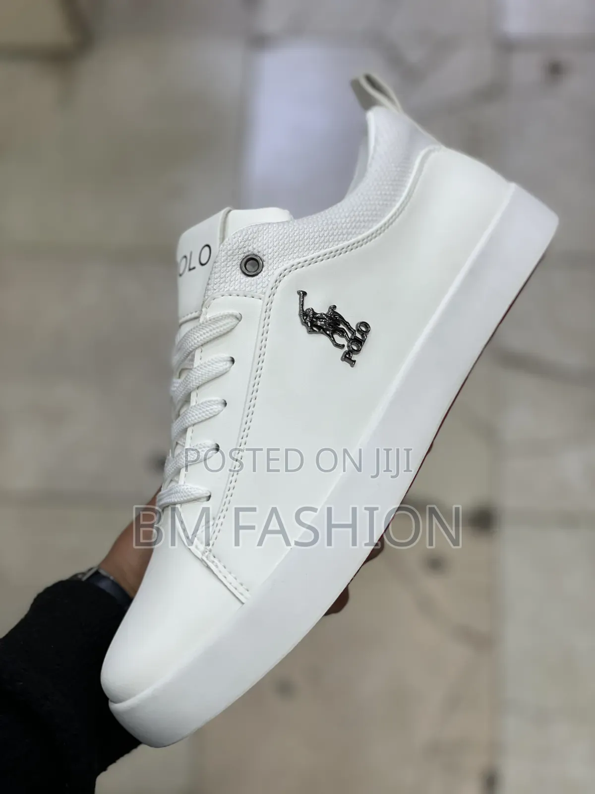 White U.S. Polo Assn. Sneaker Featuring a Contrasting Black Polo Logo