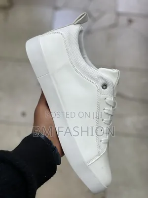 White U.S. Polo Assn. Sneaker Featuring a Contrasting Black Polo Logo