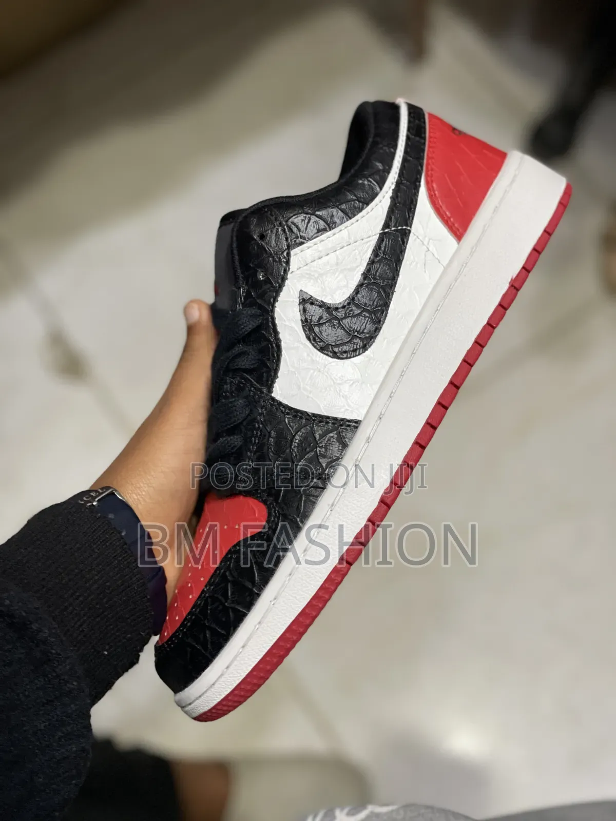 Air Jordan 1 Low Featuring a Striking Black Reptile-Textured Leather