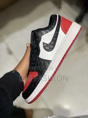 Air Jordan 1 Low Featuring a Striking Black Reptile-Textured Leather