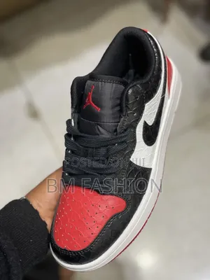 Air Jordan 1 Low Featuring a Striking Black Reptile-Textured Leather