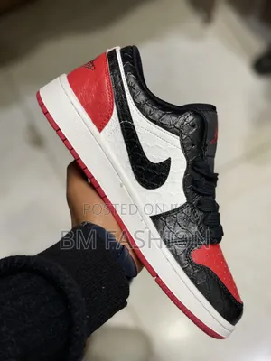 Air Jordan 1 Low Featuring a Striking Black Reptile-Textured Leather