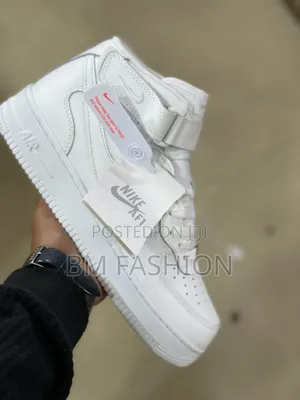 Nike Air Force 1 Mid-Top, Featuring an Ankle Strap and Leather Upper