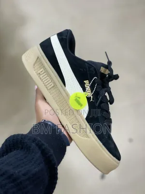 Black Suede Puma Sneakers Featuring a Thick Textured Gum Sole
