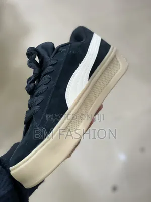 Black Suede Puma Sneakers Featuring a Thick Textured Gum Sole