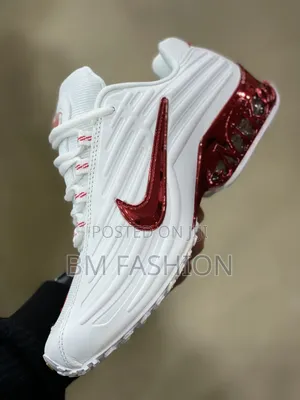 Nike Shoe Featuring a Metallic Red Swoosh and Matching Red Translucent