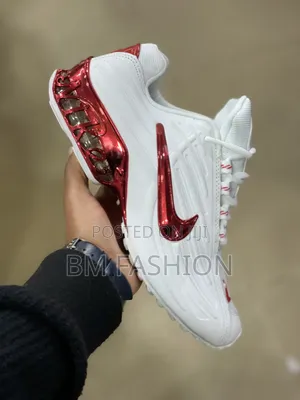 Nike Shoe Featuring a Metallic Red Swoosh and Matching Red Translucent