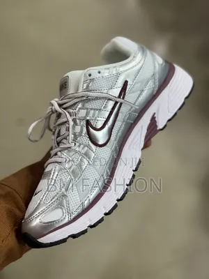 Of Nike P-6000 Sneakers Featuring a Shiny Metallic Silver Mesh Upper