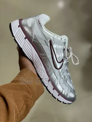 Of Nike P-6000 Sneakers Featuring a Shiny Metallic Silver Mesh Upper