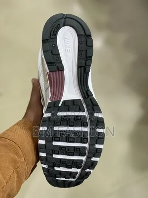 Of Nike P-6000 Sneakers Featuring a Shiny Metallic Silver Mesh Upper