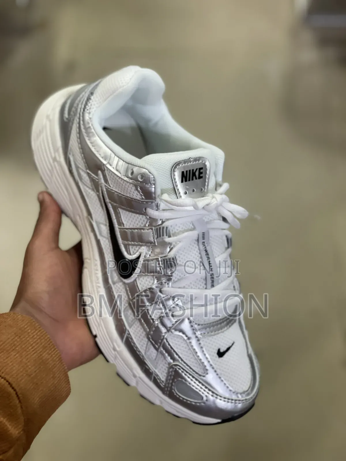 Nike P-6000 in a White and Metallic Silver Colorway With a Black Swosh